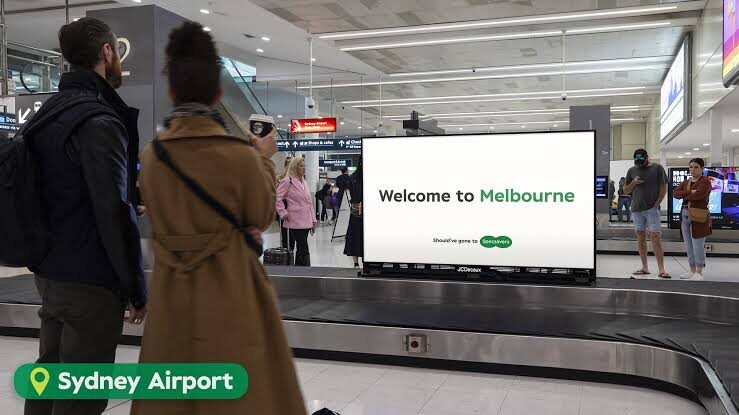 Specsavers out of home at Sydney Airport, welcome to Melbourne